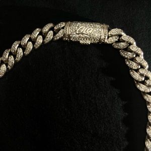 White gold Cuban link chain.